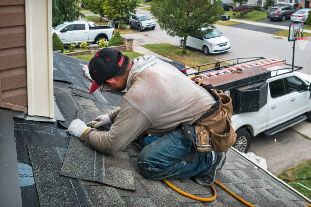 Professional Roofing technician working in New Town, MA